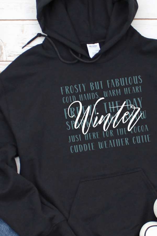 “Limited edition Winter Word Collage Hoodie with festive seasonal designs”